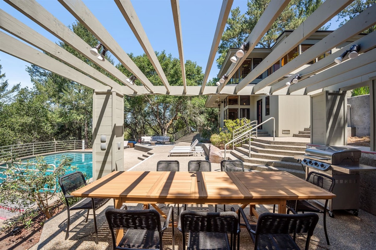 Large outdoor teak dining table comfortably seats 12. Outdoor grill with propane included.