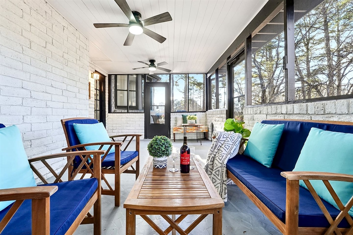 Inviting and spacious sunroom featuring ample seating, perfect for relaxing, unwinding, or spending quality time together.
