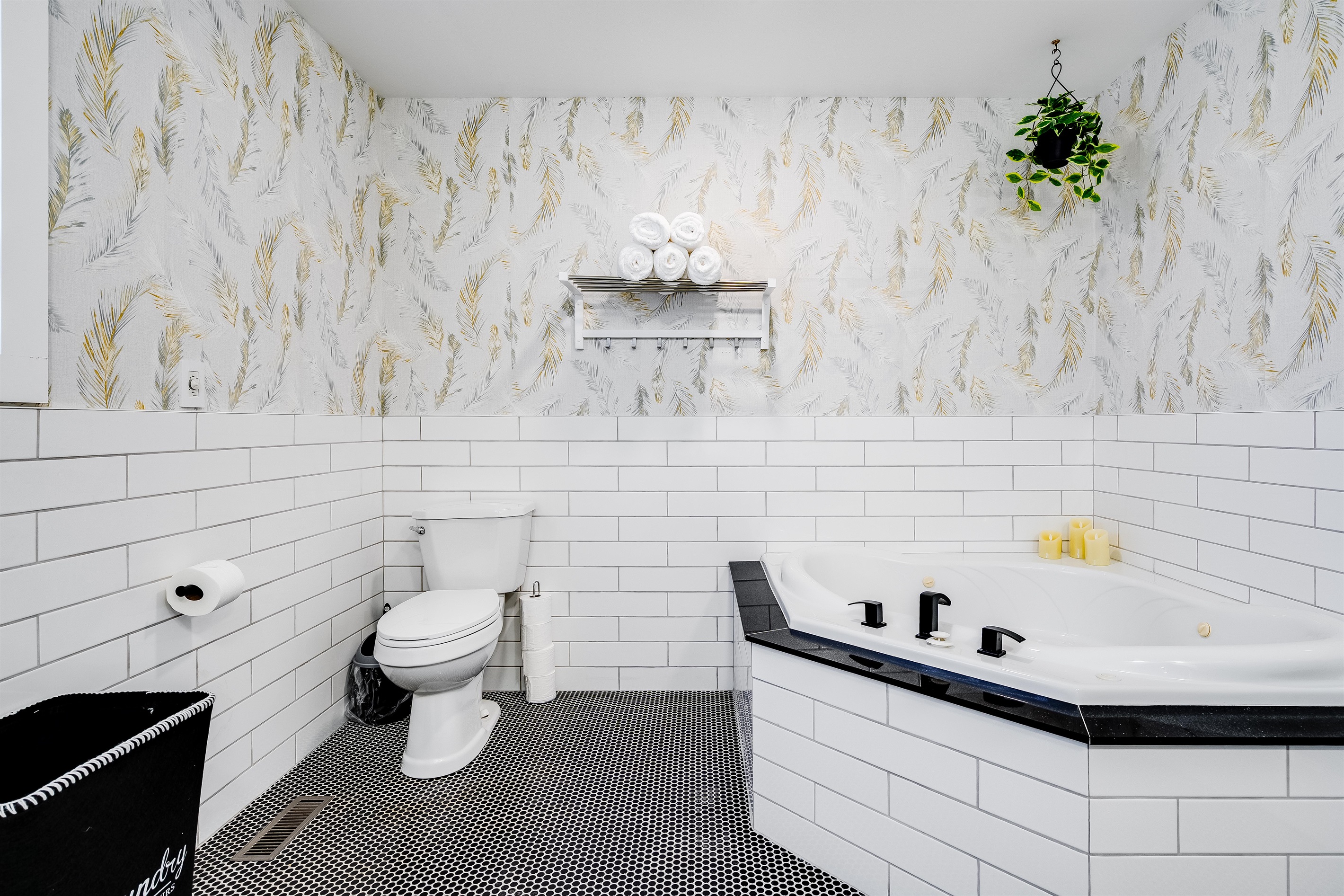 A Full bathroom with a serene spa experience in sculpted stone