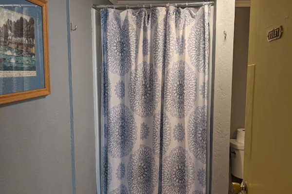 Full bathroom with upright shower