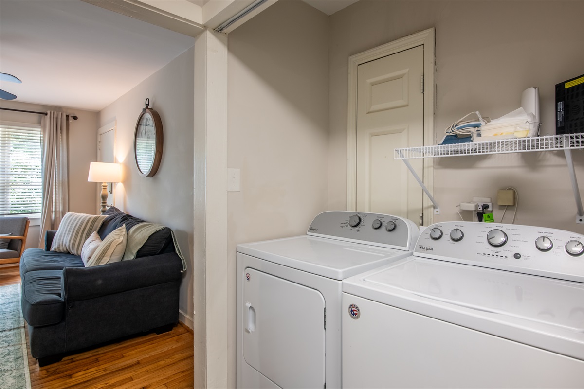 Laundry nook with washer and dryer, conveniently located just off the main living area for guest use.