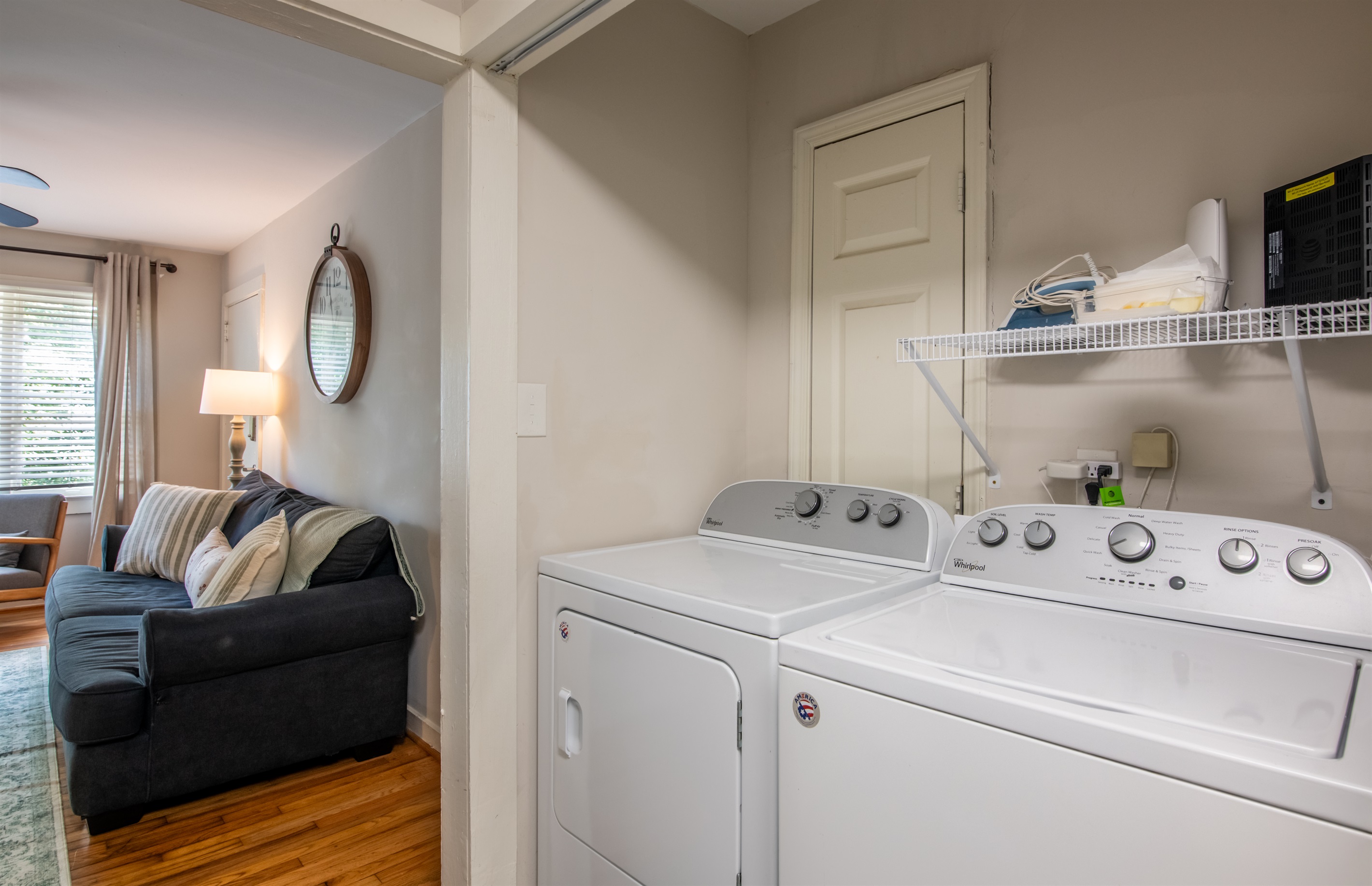 Laundry nook with washer and dryer, conveniently located just off the main living area for guest use.
