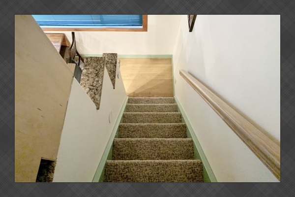 Stairs leading to and from loft area.