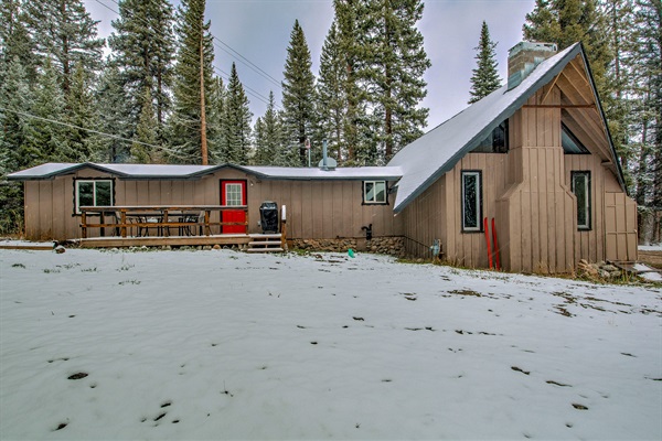 The Velvet Moose - known by the original owners as "the red ski cabin." Spread out in your private mountain getaway—snowy yard, forest surroundings, and a cozy cabin exterior that invites you to relax and make it yours.  