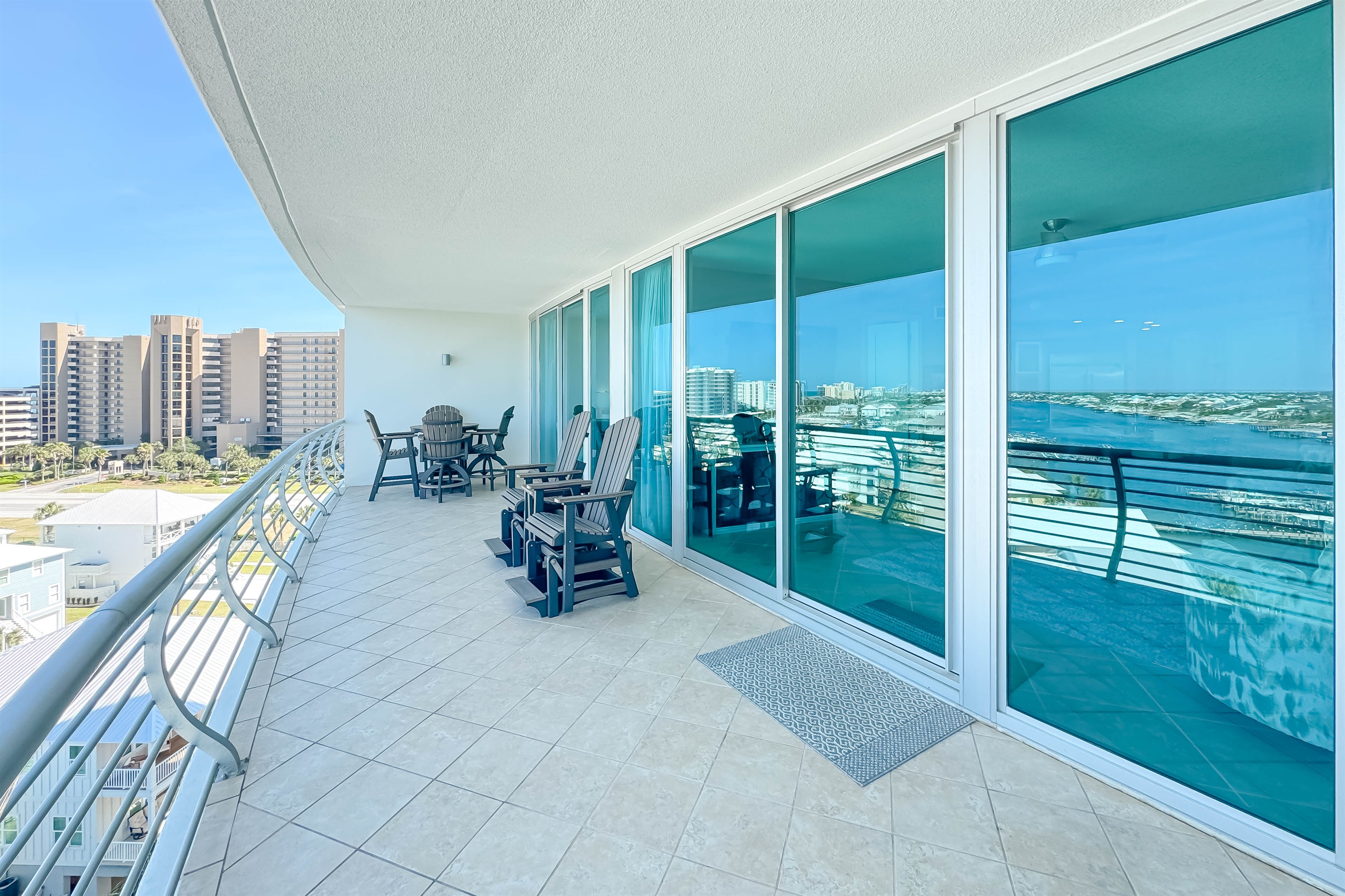 Elevated living at its finest. This spacious balcony offers breathtaking vistas of the bay, providing an idyllic setting for morning coffee or evening sunsets. Experience the ultimate in waterfront luxury.