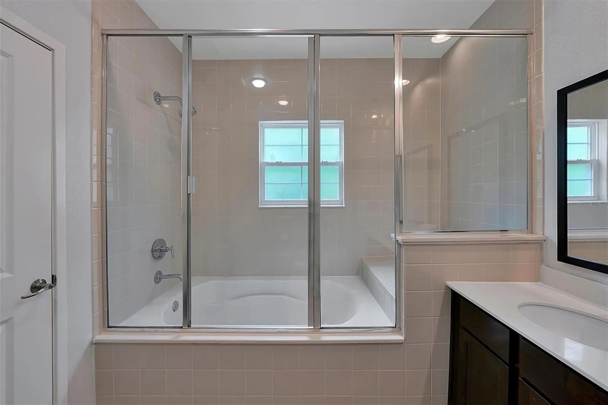 Spacious tub/shower area in master bathroom