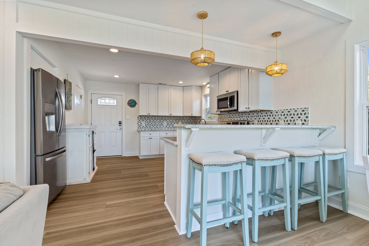 Pull up a seat at the breakfast bar for casual bites, morning coffee, or good conversation while dinner comes together