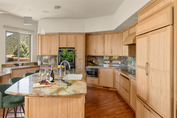 Cook and connect. The open-concept kitchen seamlessly integrates with the dining and living areas, allowing your whole group to stay engaged while preparing meals.