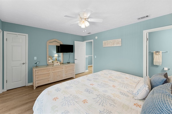 Bedroom #2 with king bed, ceiling fan, smart TV and ensuite bathroom