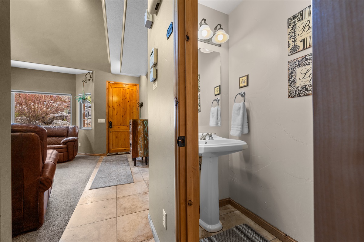 Easy flow and thoughtful design make every moment feel relaxed and effortless. Half bath on the main level is on your right.