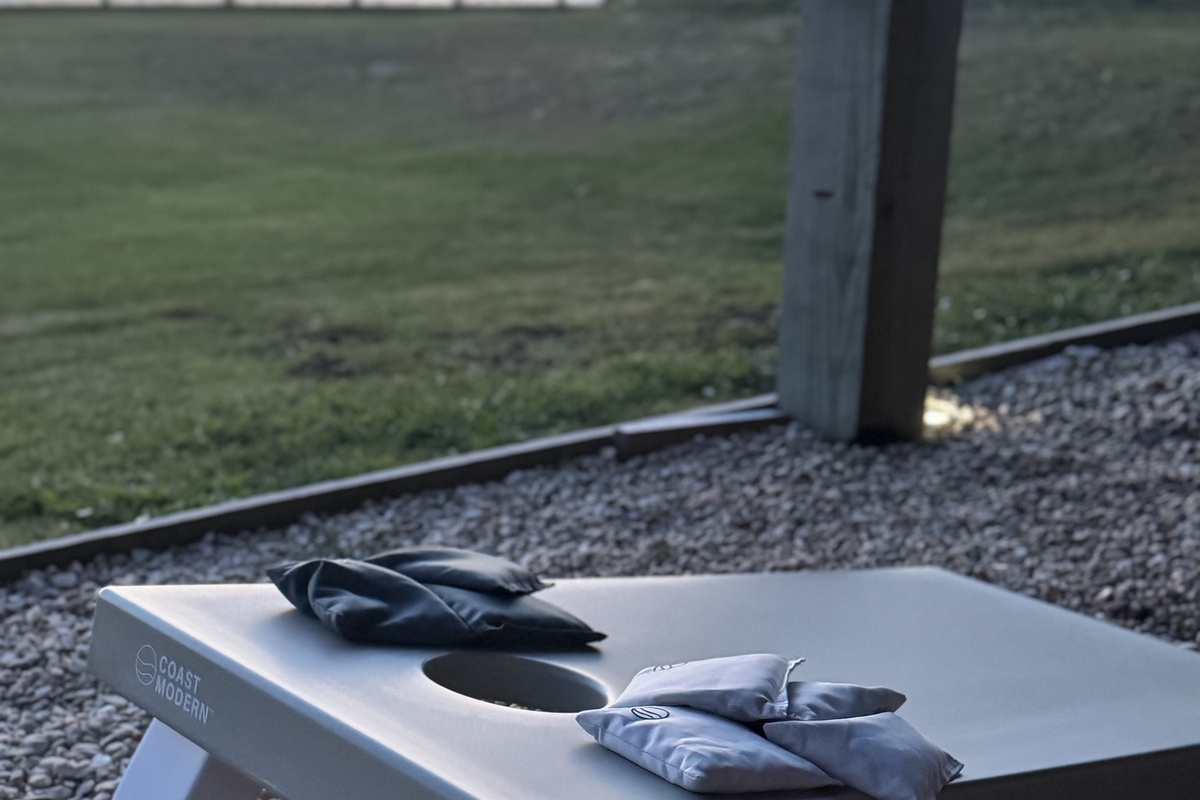 Let's play cornhole! Located under the house in the shade.