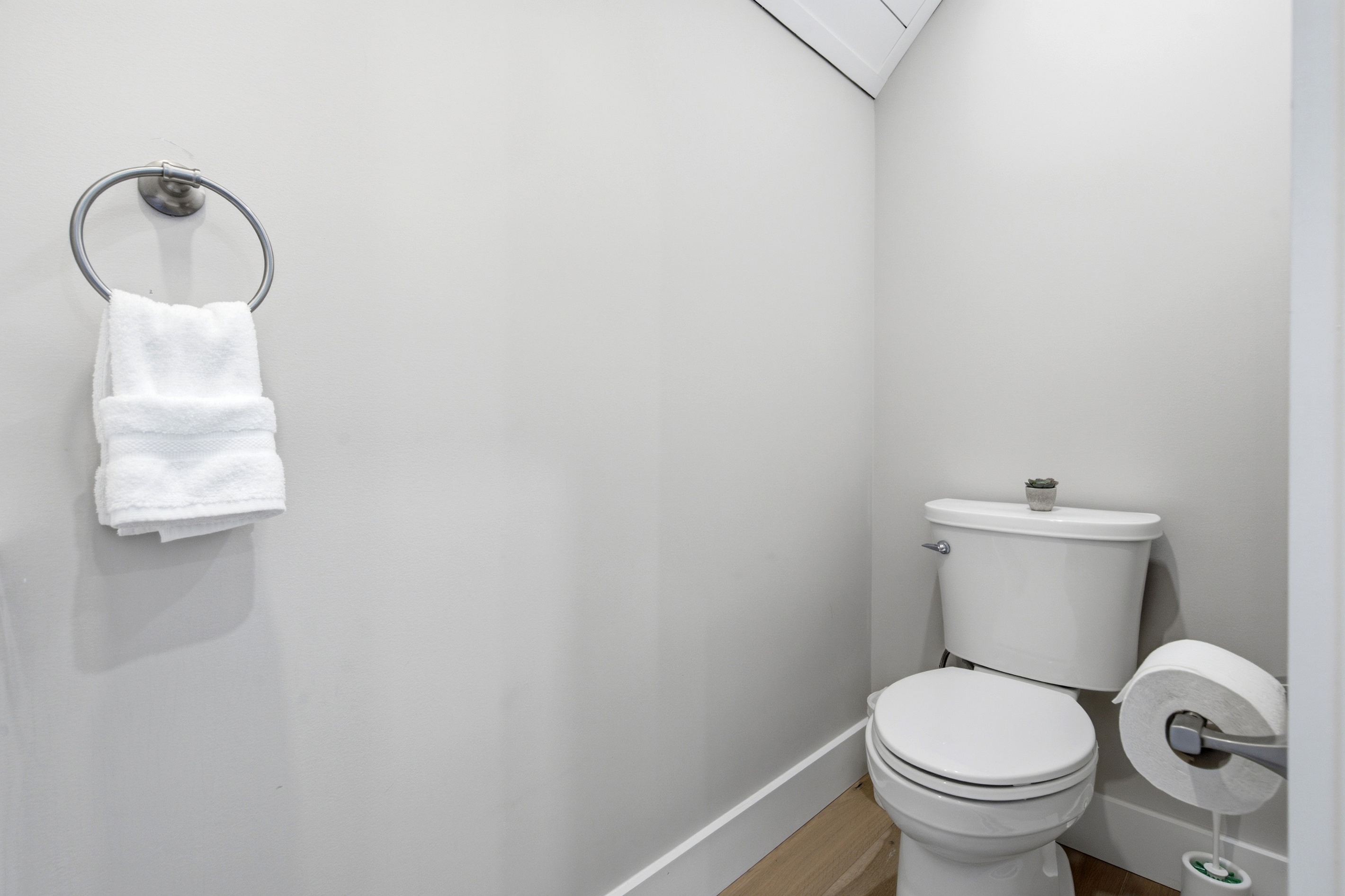A convenient half bath adds extra comfort for families and larger groups.