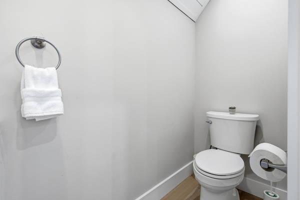 A convenient half bath adds extra comfort for families and larger groups.