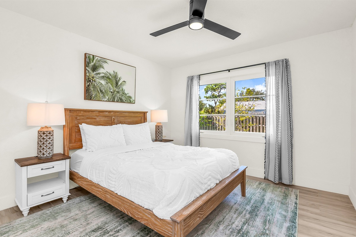 Bedroom 2 offers a relaxing coastal vibe with crisp linens, warm natural light and elegant decor- perfect for guests seeking comfort and tranquility after a day in paradise