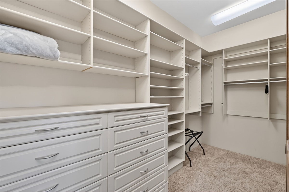Oversized walk-in closet connected to the primary suite offers generous storage for longer stays and group travel