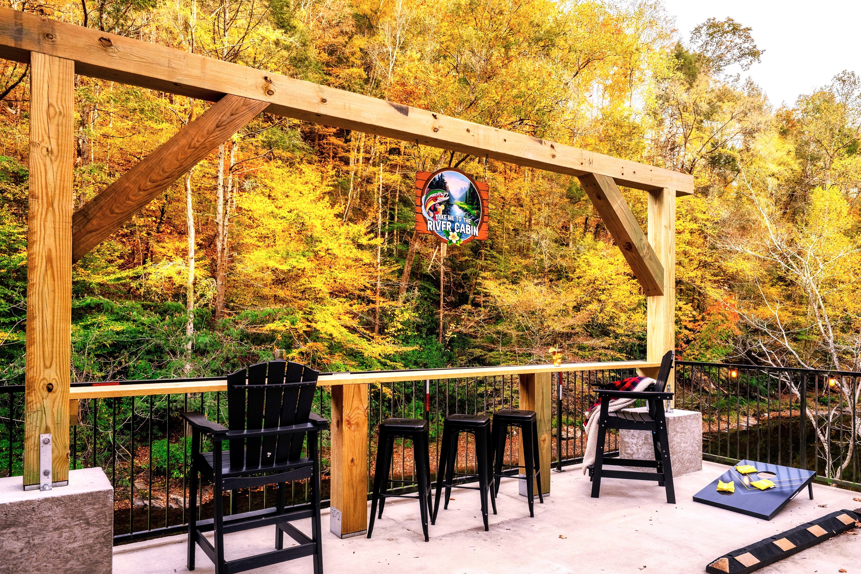 Check out this impressive post & beam that also functions as a bar table area that overlooks the "Little Pigeon River". Make it your one-of-a-kind experience while listening in to the rushing sound of water while watching wildlife in front of you.