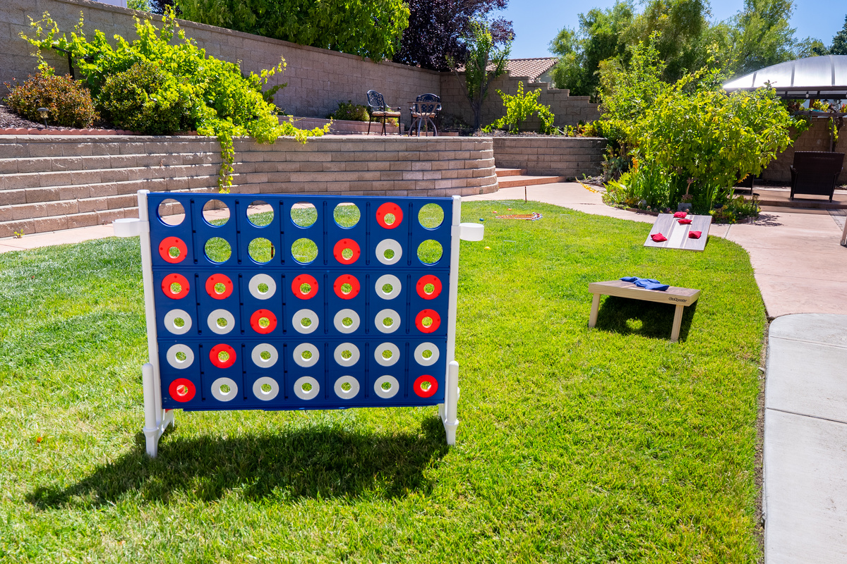 Enjoy a collection of lawn games in the backyard.