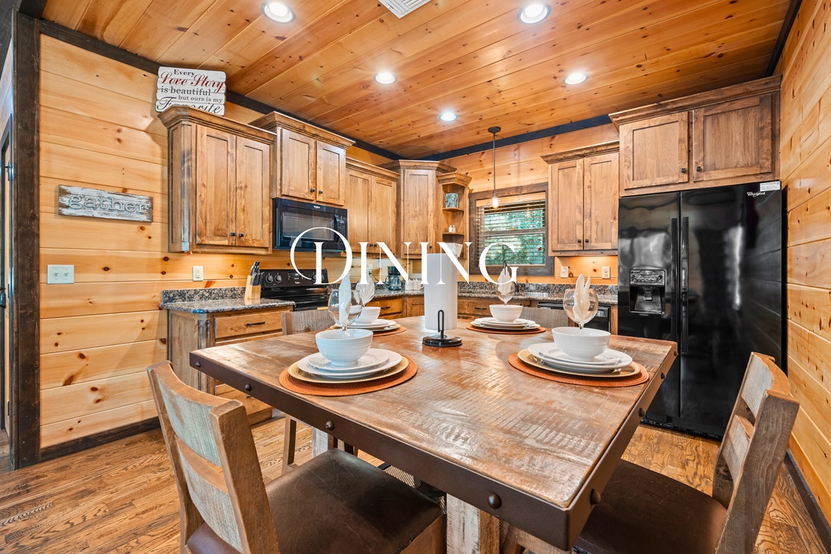 Dining area with rustic wooden table set for four.