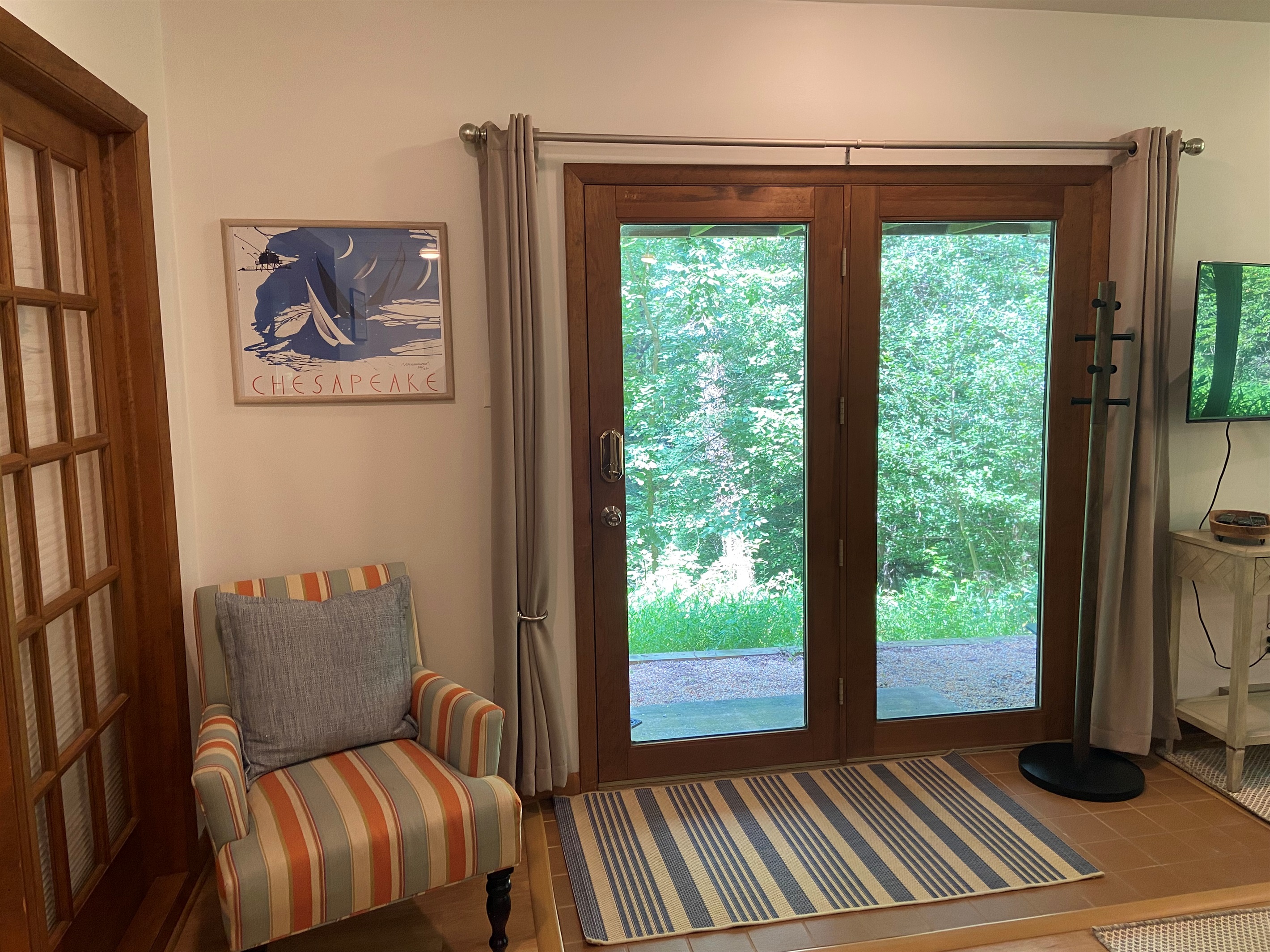 Entry way to the space includes a standing coat rack.