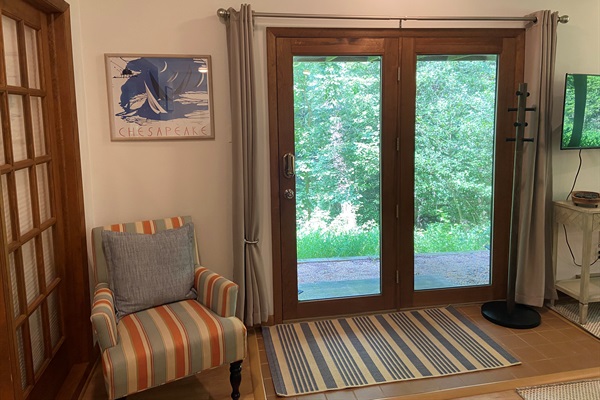 Entry way to the space includes a standing coat rack.