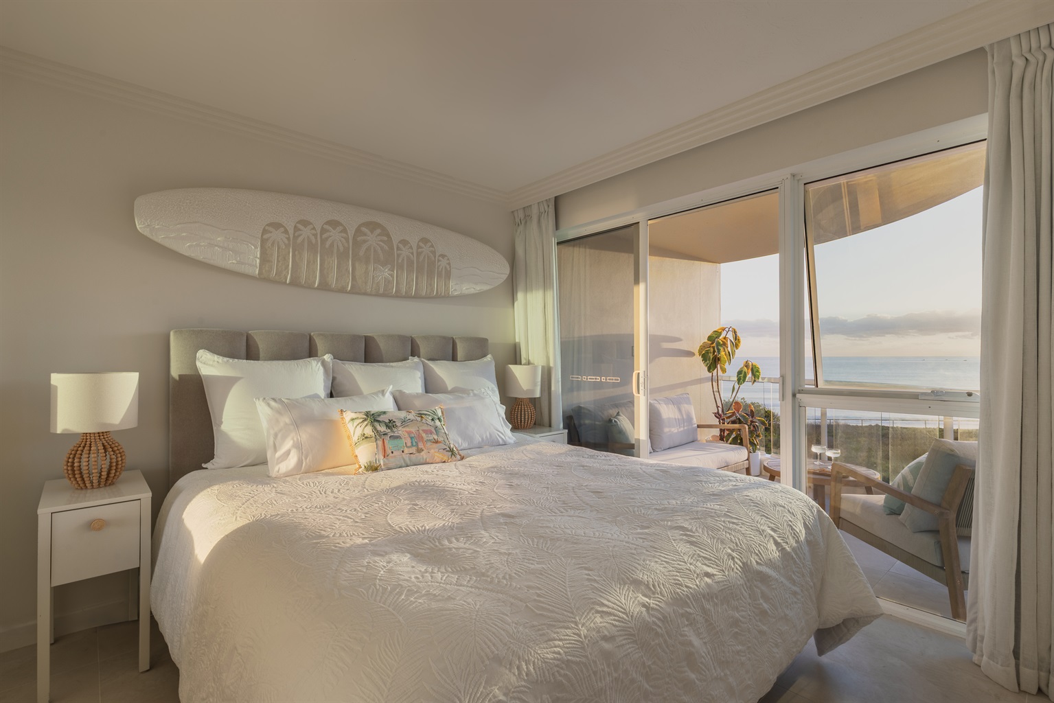 King bed with direct balcony access + uninterrupted ocean views