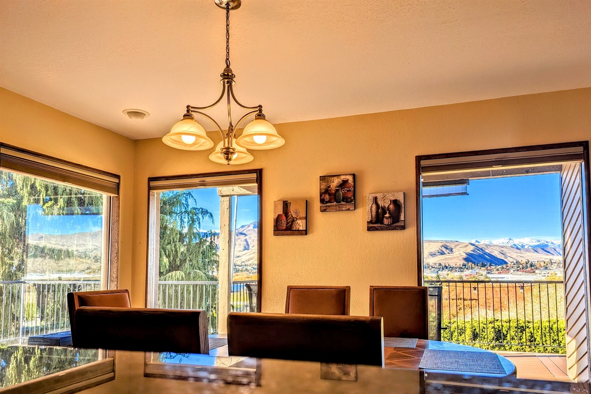 Spacious dining room with tons of natural light and panoramic Cascade Mountains and Columbia River views.