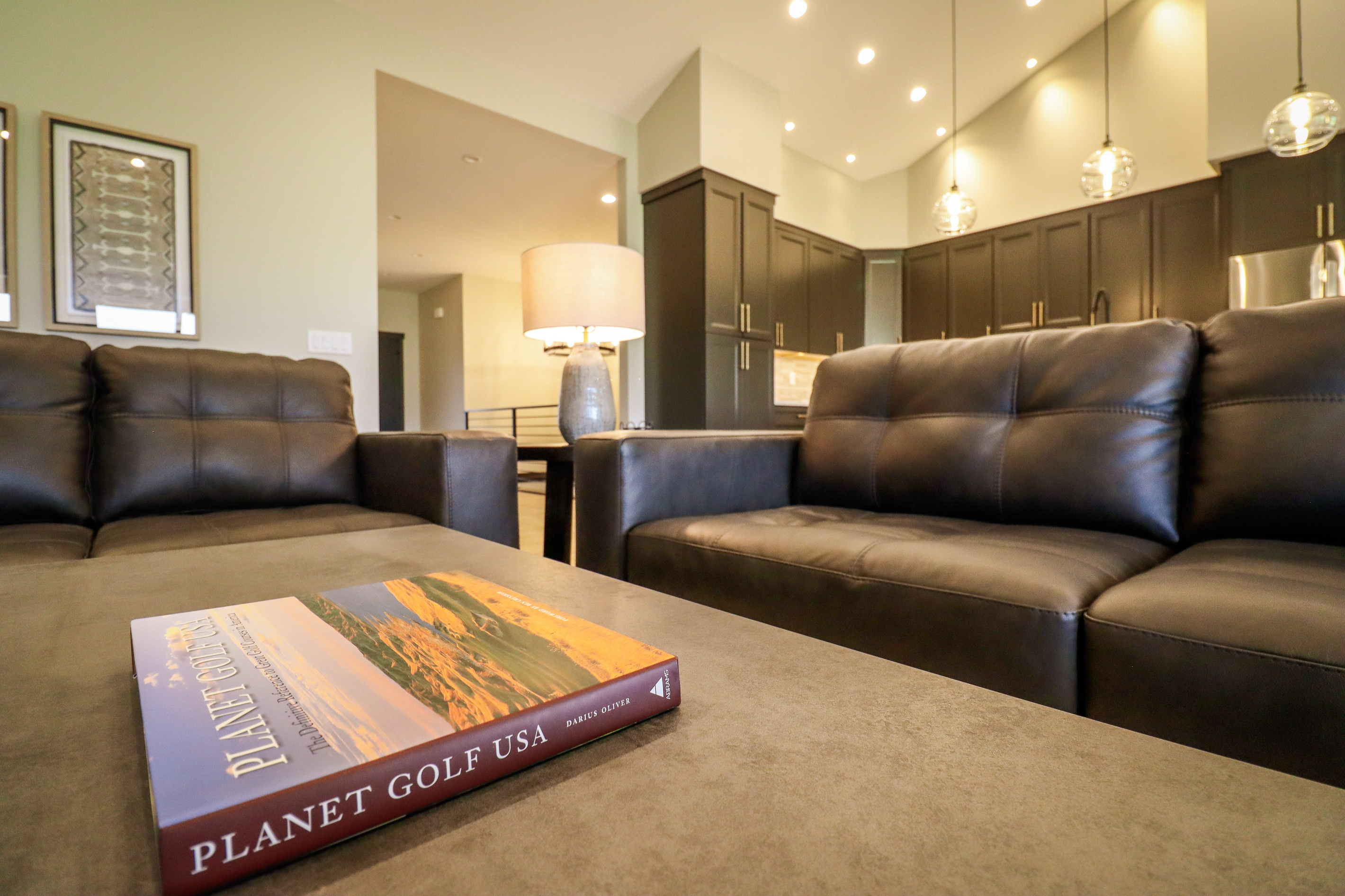 Open concept living room, kitchen with dining area.
