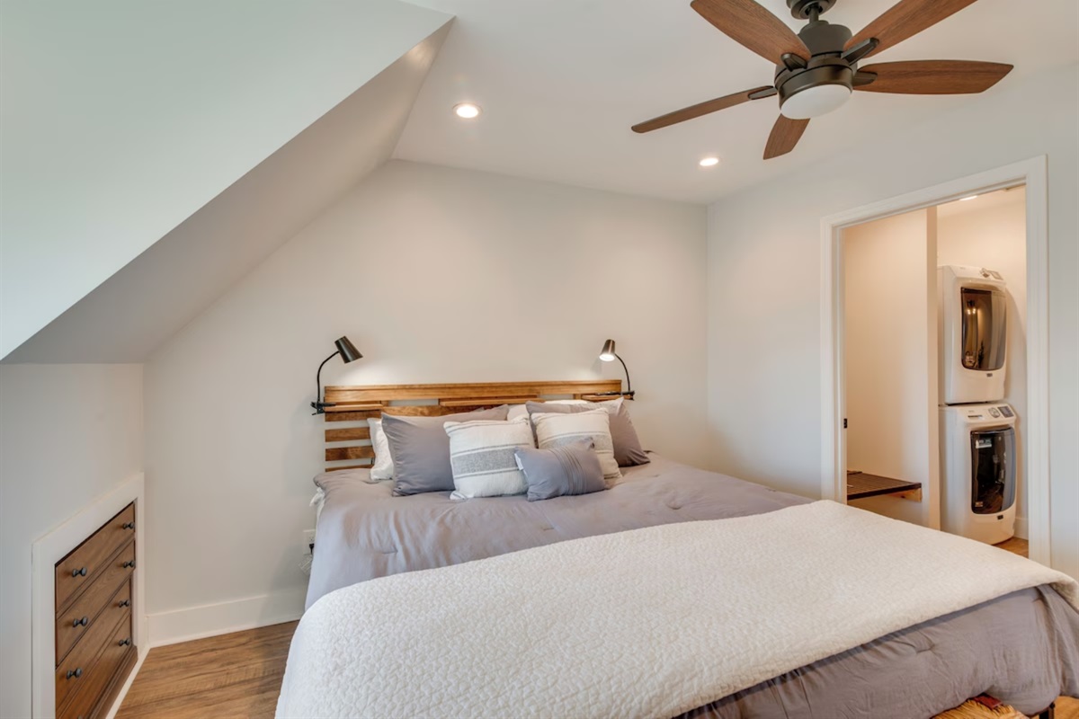 Bedroom with ceiling fan and king bed