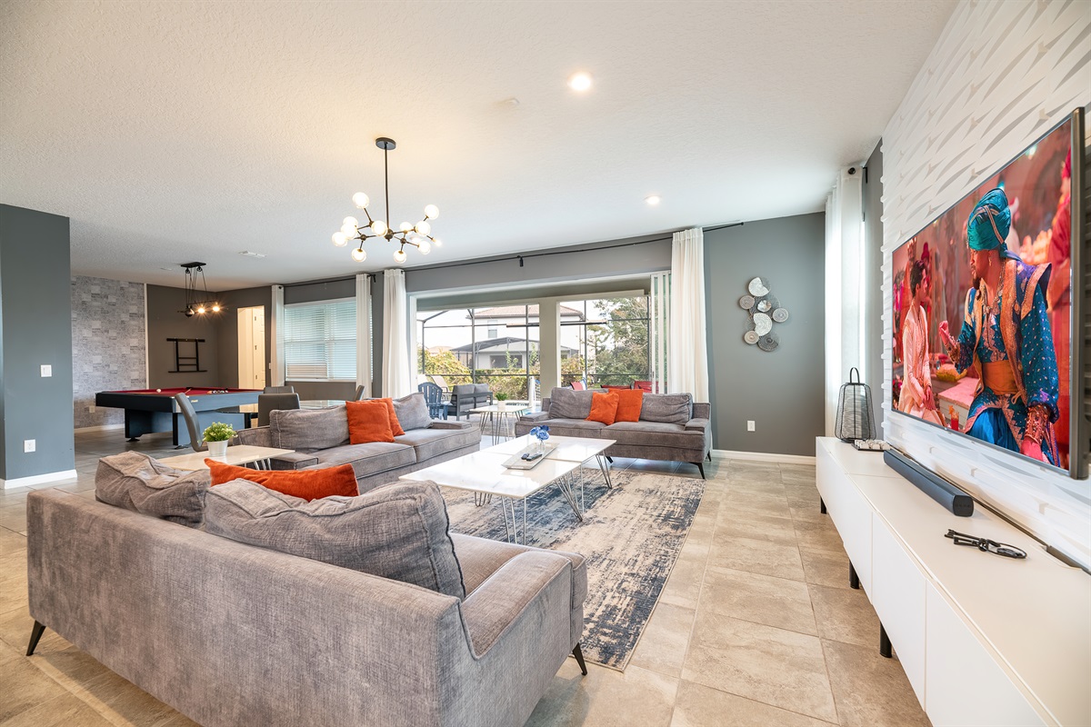 Living Room Oasis: Bright and airy space with stylish decor and billiards for endless fun!