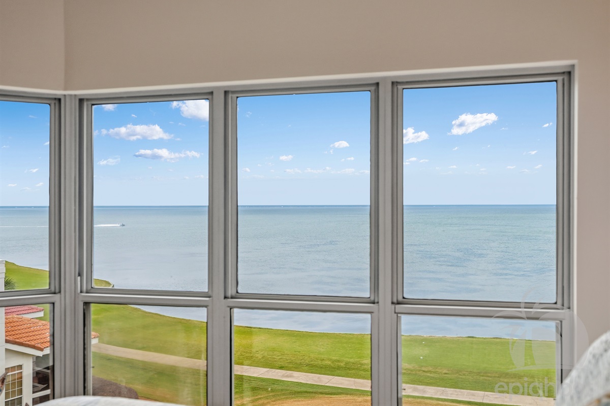 Floor-to-ceiling windows overlooking the bay