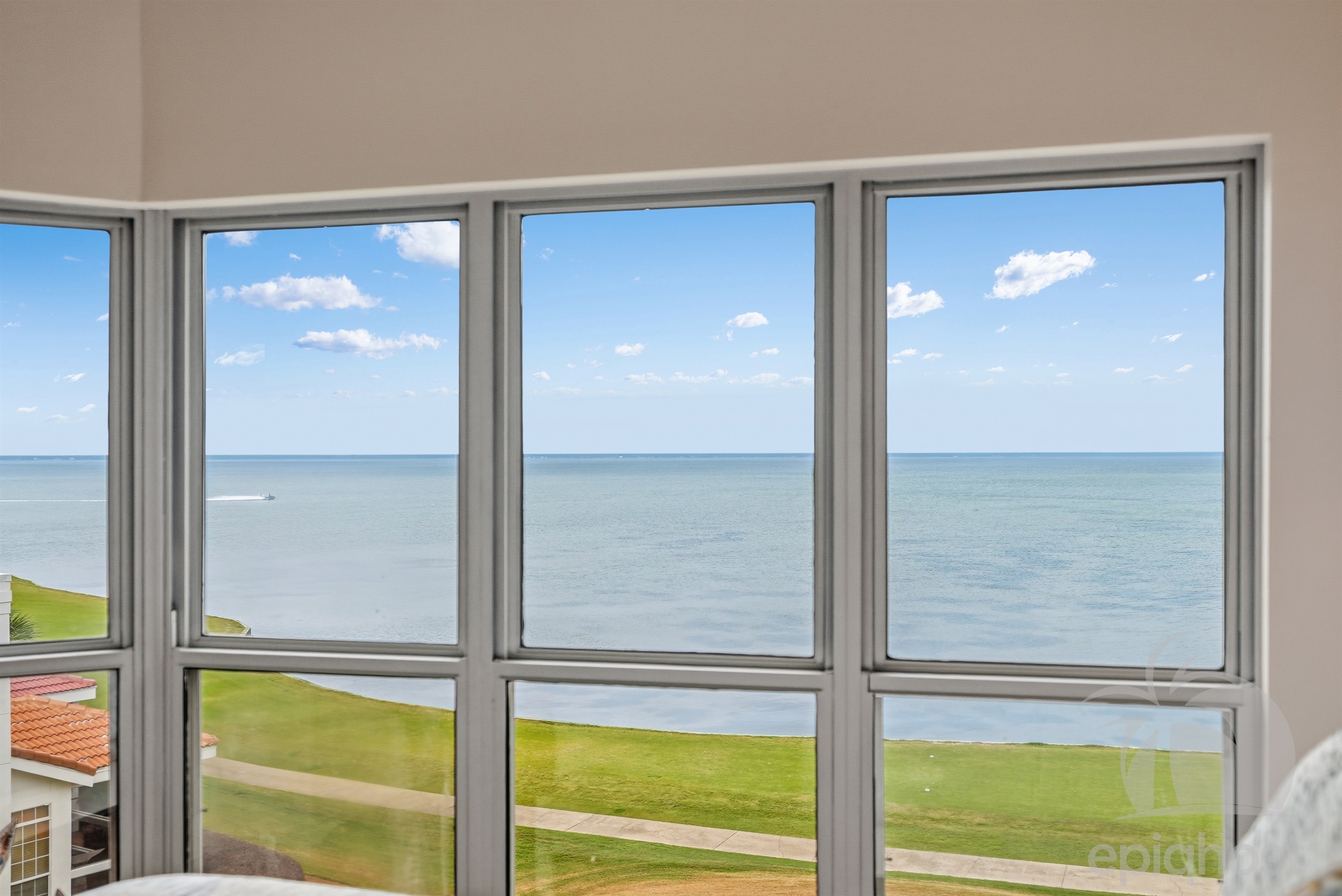 Floor-to-ceiling windows overlooking the bay
