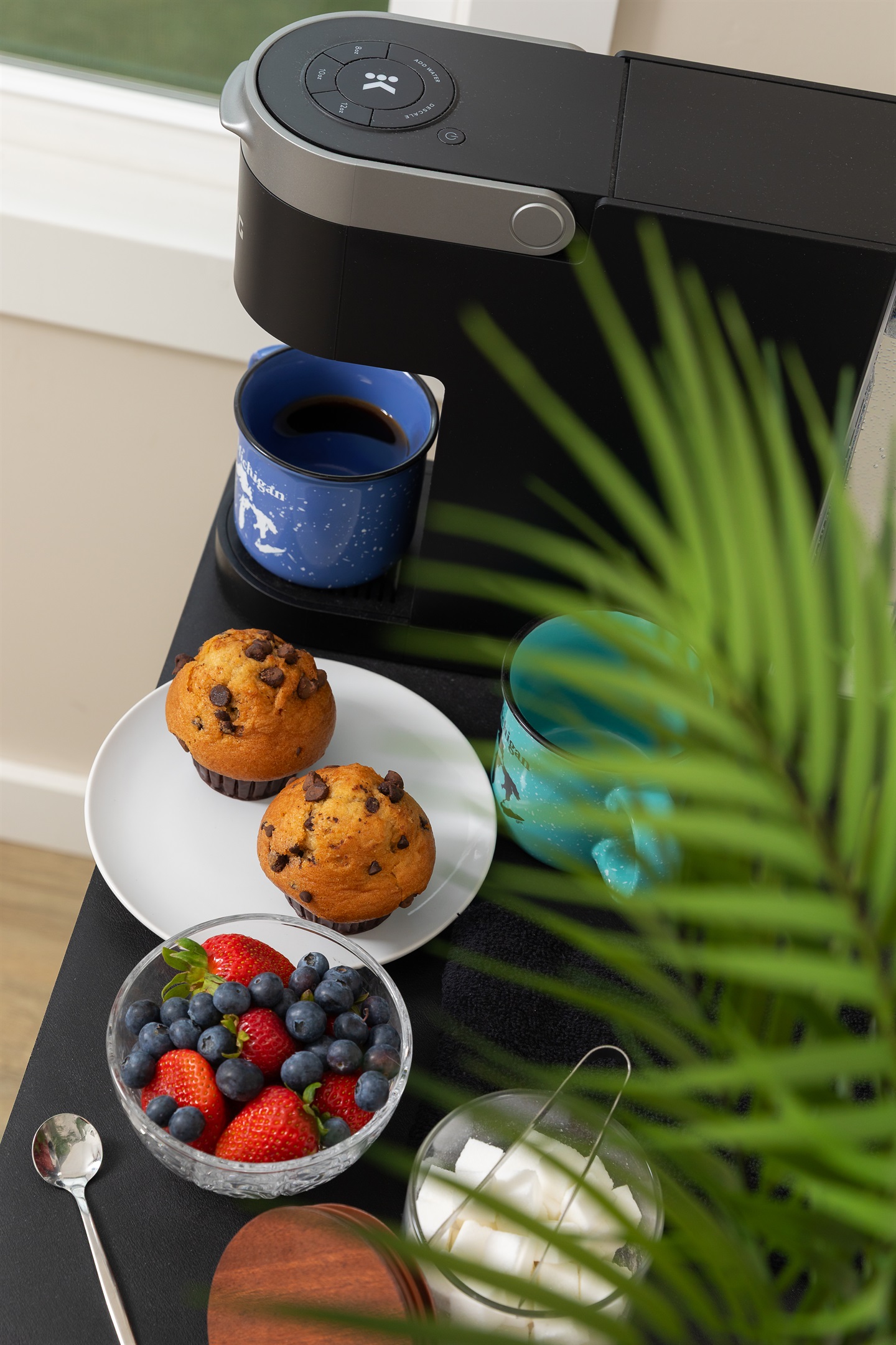 Start your day with a cup of coffee from either the downstairs dual pot or a cup from the upstairs Keurig coffee bar. 

Food for staging purposes only/not provided. 