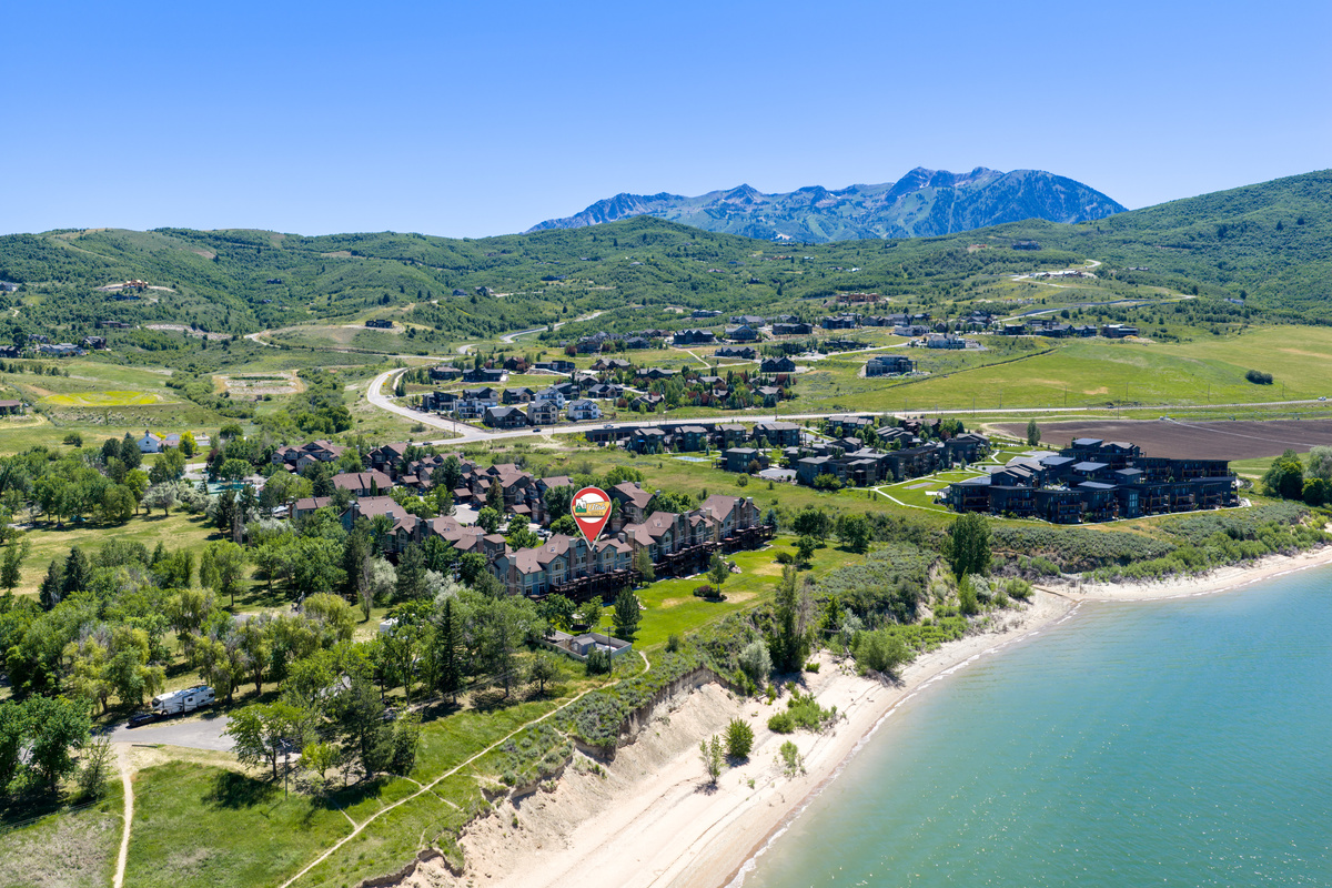 Aerial view of Lakeside Village surrounded by mountains.