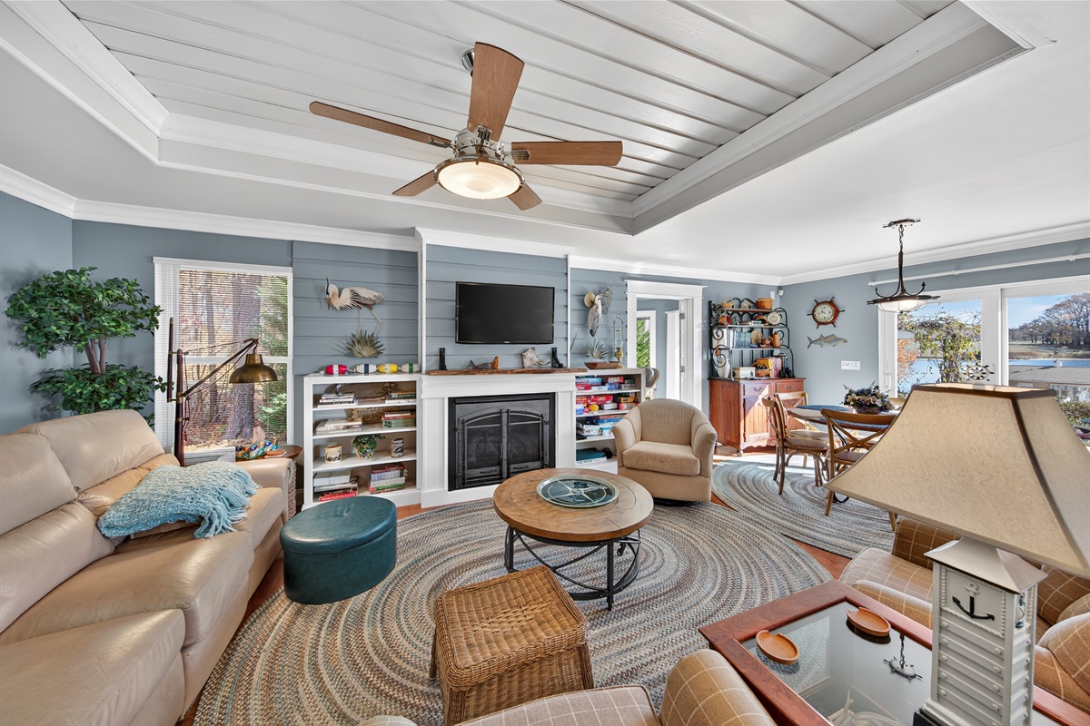 The living room opens into the sunroom, creating a welcoming extension of the main space, but providing a separate space for kids or adults..