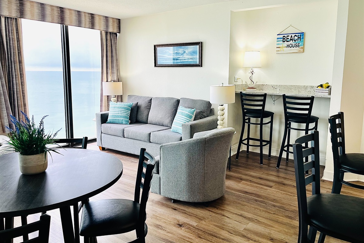 Immerse yourself in open-concept living, where the living area seamlessly transitions into the dining space, creating a spacious and welcoming environment for both relaxation and entertaining.