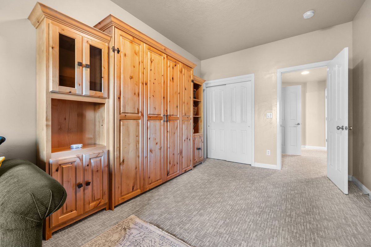 Murphy bed tucked away to maximize living space during the day.