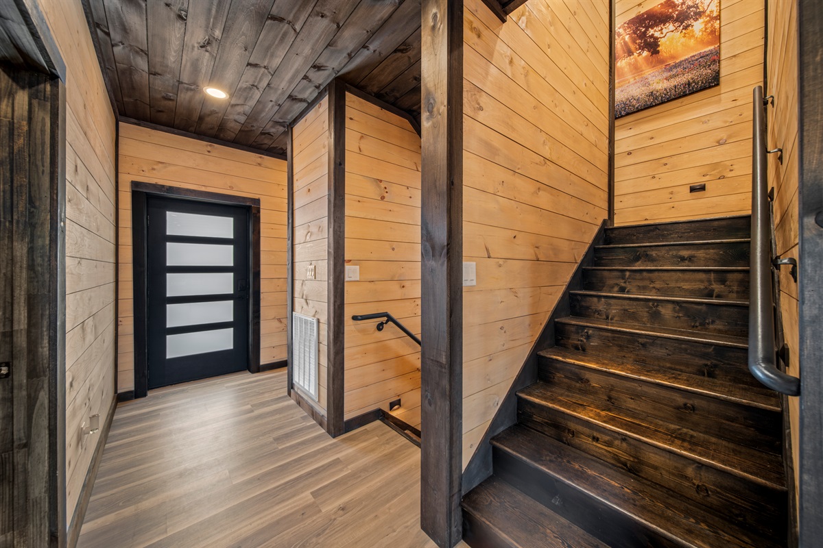 Stylish main-level entrance with staircases and open-concept design