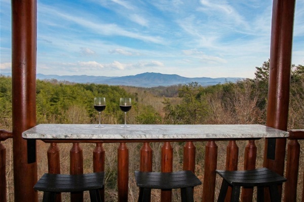 Private deck bar with a breathtaking Mount LeConte view, made for sunrise coffee, evening wine, and quiet mountain memories.