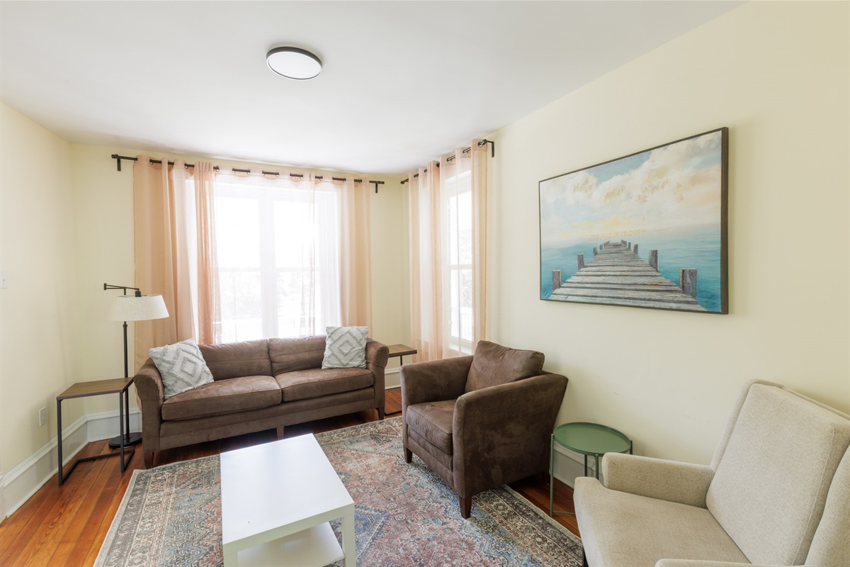 Living room with comfortable seating and a Smart TV.