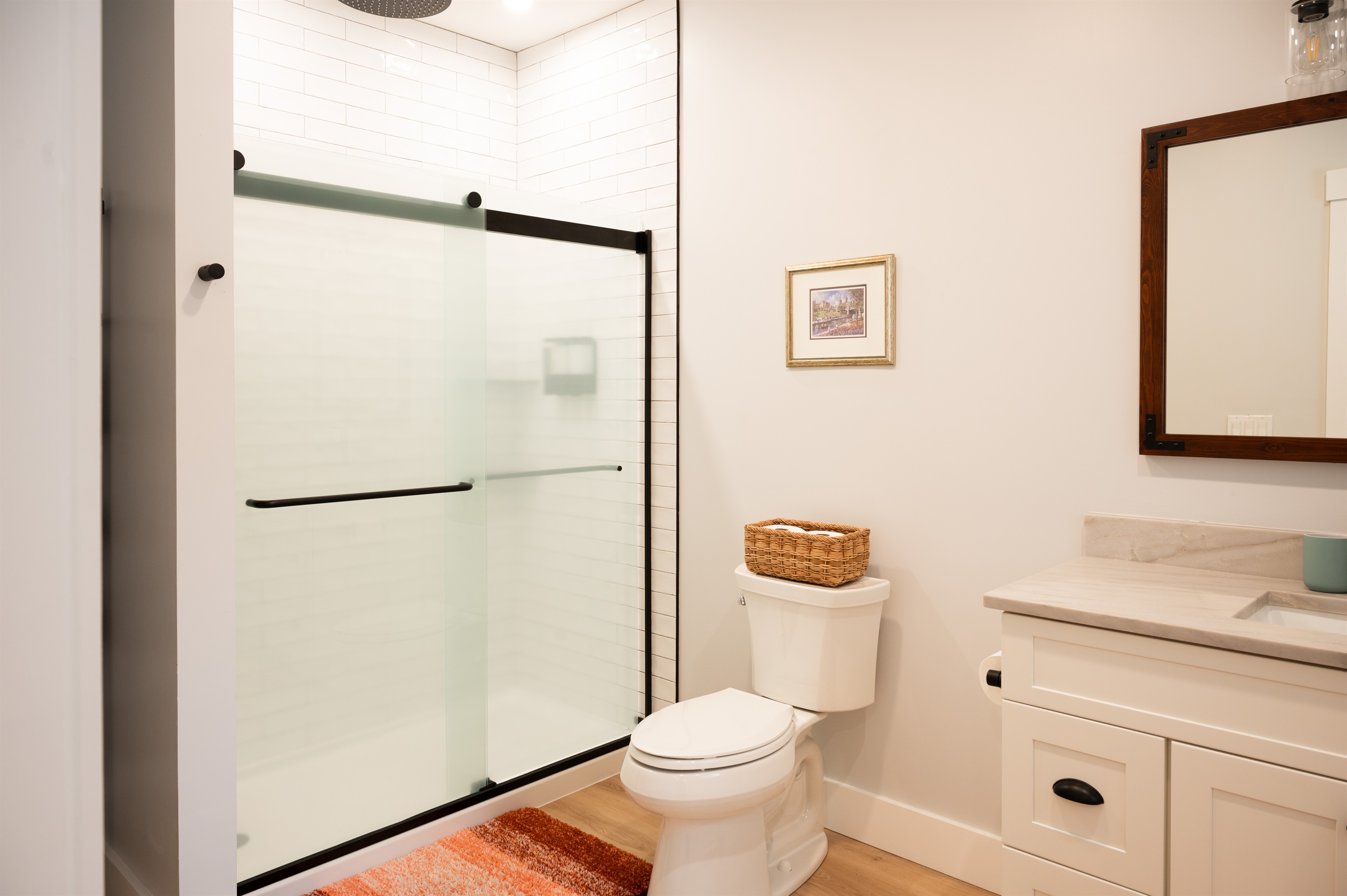 Bathroom shower, toilet, and vanity