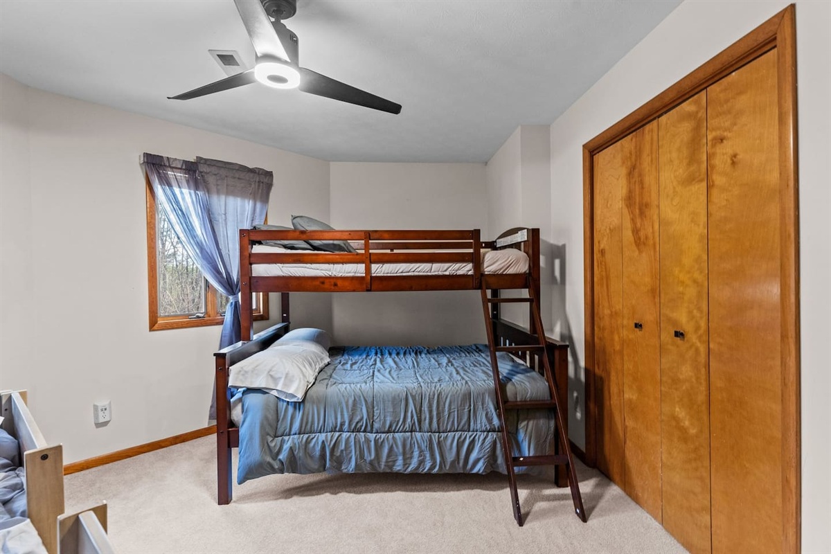 Bunk Bedroom 3: Fun and functional with cozy bunks for a delightful family adventure!