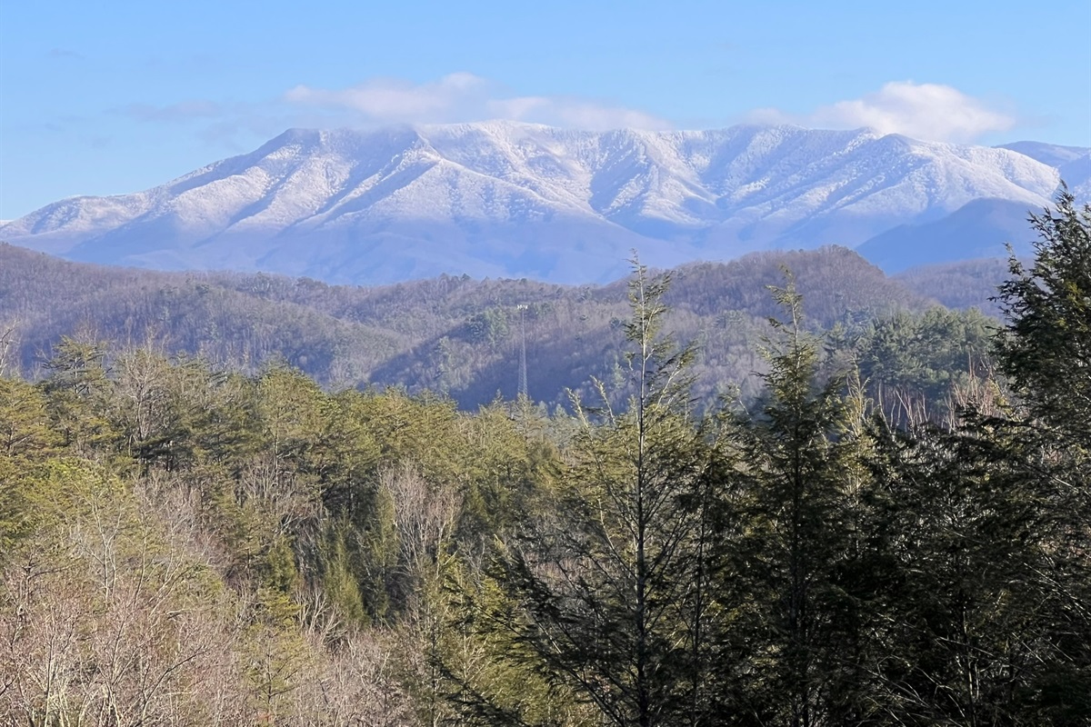 Snow capped mountains make for a magical winter mountain experience.