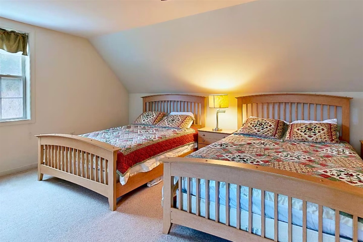 First bedroom on second floor with 2 Queen sized beds.
