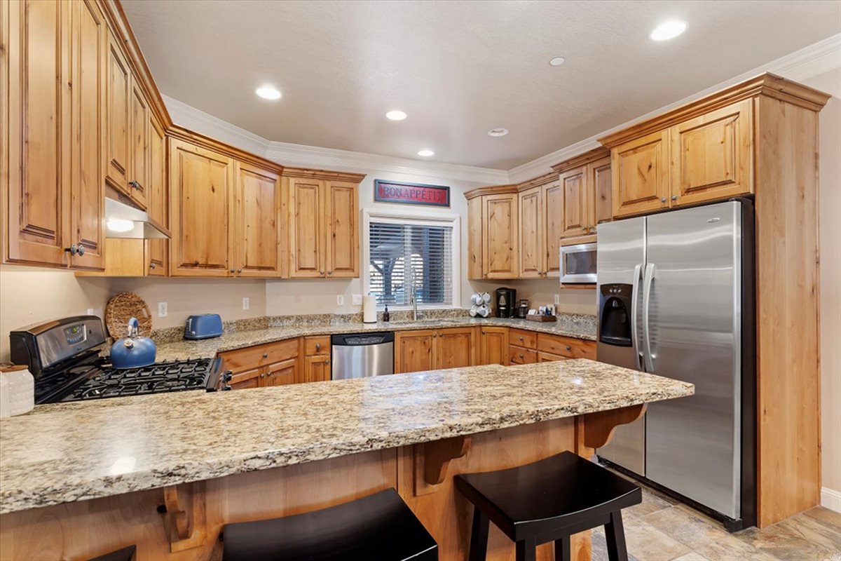 A fully equipped kitchen with expansive counter space and modern appliances, designed to make cooking and entertaining effortless.