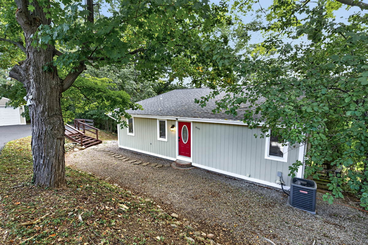 Side exterior with red entry door