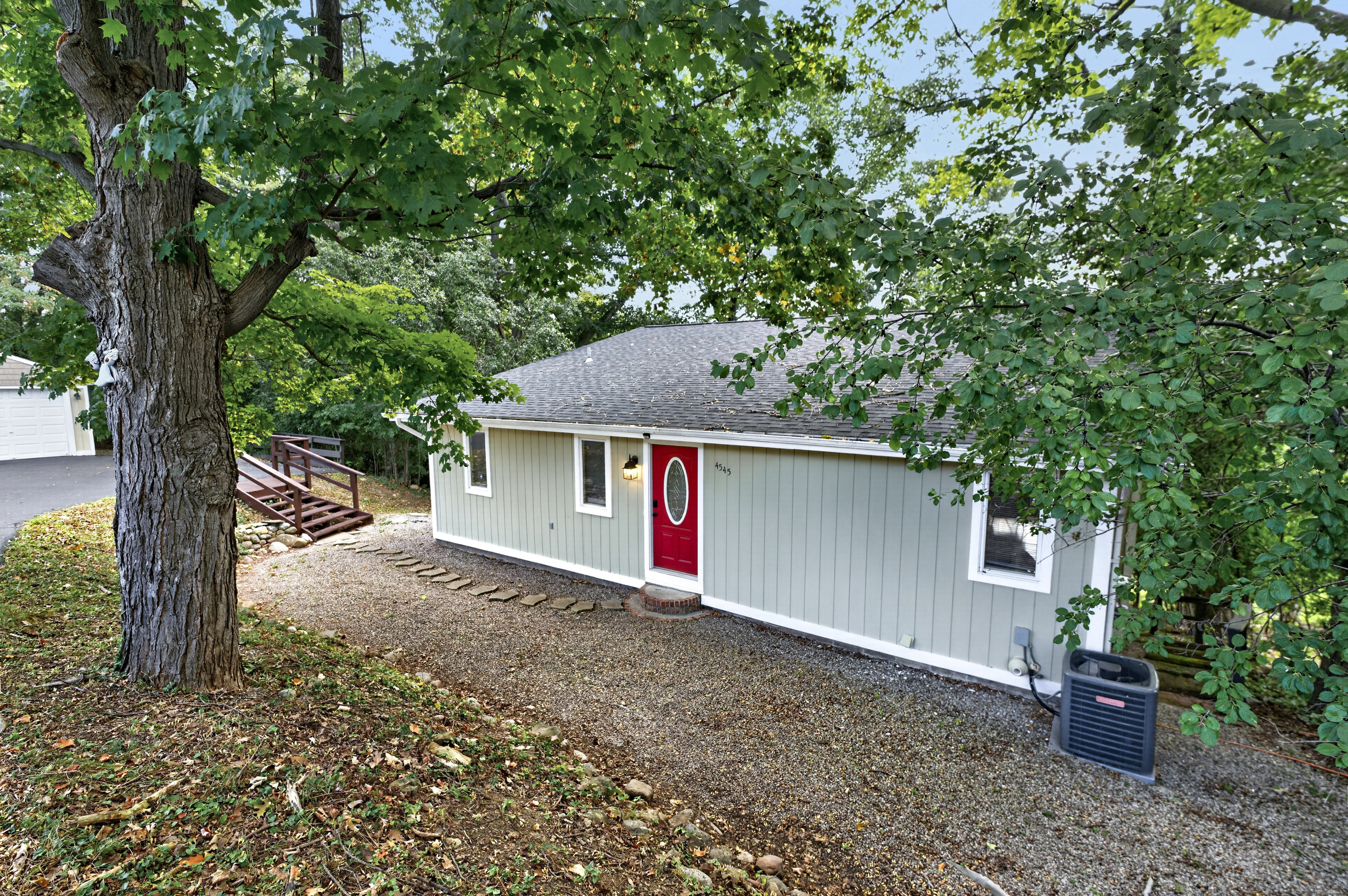 Side exterior with red entry door