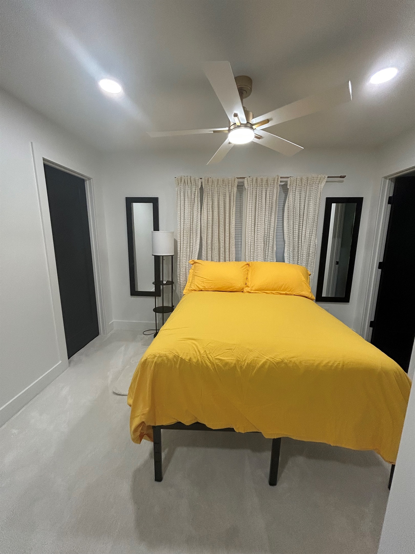 Bedroom located upstairs with double beds, walk-in closet, and ensuite 1/2 bathroom
