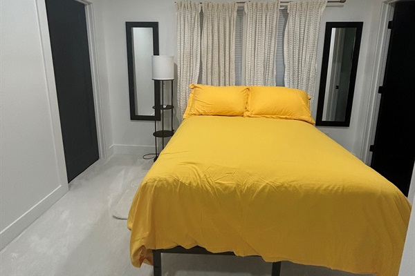 Bedroom located upstairs with double beds, walk-in closet, and ensuite 1/2 bathroom