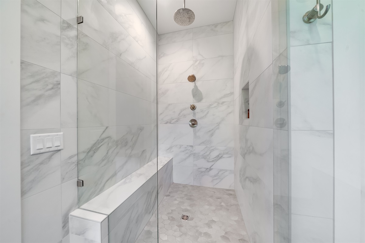 Ensuite Bathroom 2 - Attached to King Suite 2. Featuring oversized rain shower with dual showerheads, soaking tub and spa-quality marble finishes. Includes premium toiletries (body wash, shampoo, conditioner, hand soap) and hotel quality towels.