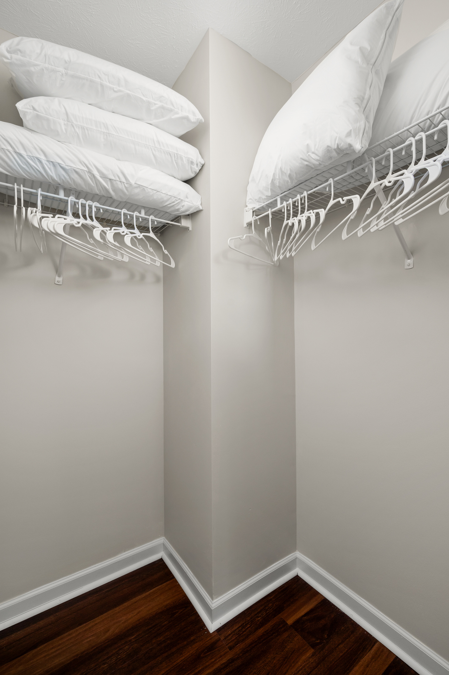 The spacious walk-in closet provides plenty of room to unpack, hang clothes, and store luggage, helping you feel right at home during your stay.